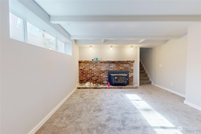 basement with carpet and a wood stove