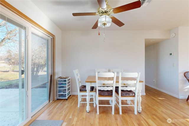 dining space featuring light hardwood / wood-style flooring and ceiling fan