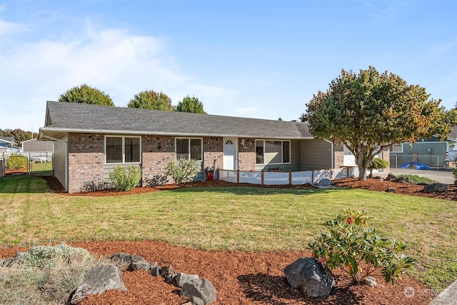 single story home with a front yard