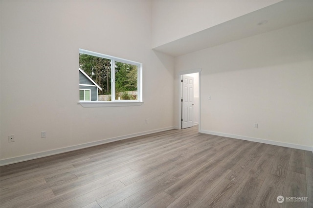 empty room with light hardwood / wood-style floors