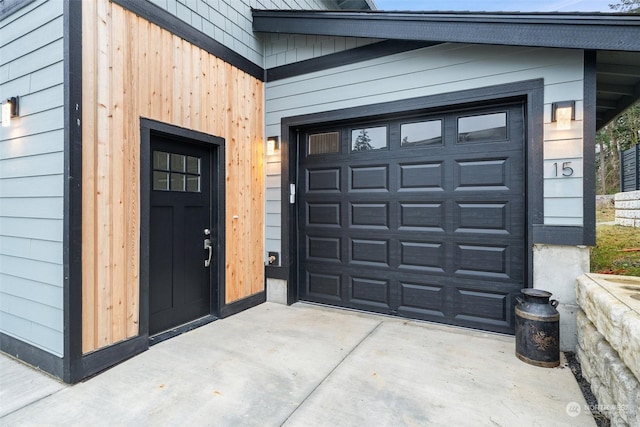 view of exterior entry with a garage