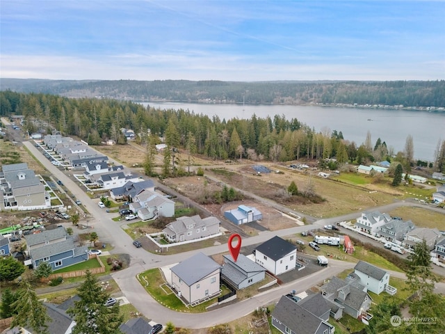 birds eye view of property featuring a water view