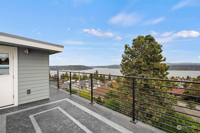 balcony featuring a water view