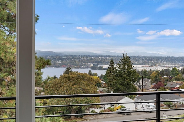 balcony with a water and mountain view