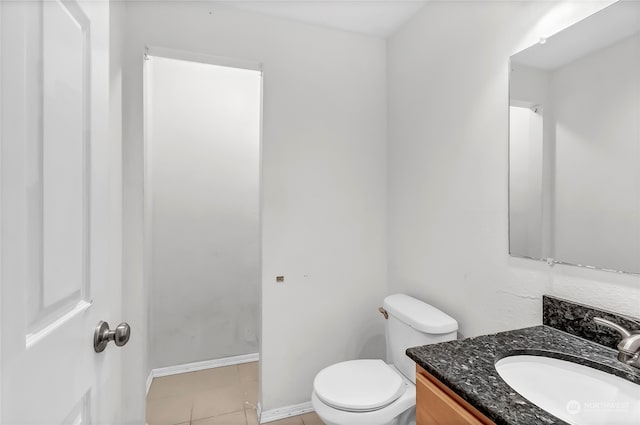 bathroom featuring tile patterned floors, toilet, and vanity