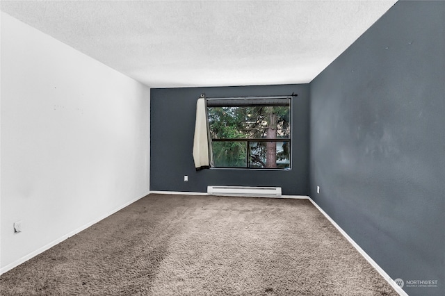 carpeted spare room featuring a textured ceiling and baseboard heating