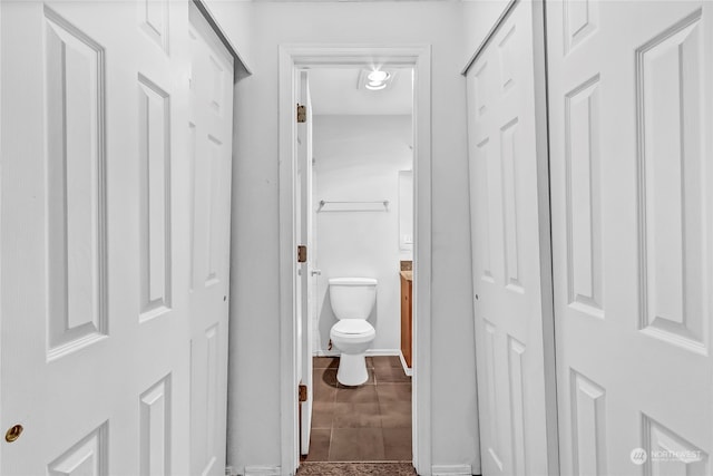 bathroom with vanity, tile patterned floors, and toilet