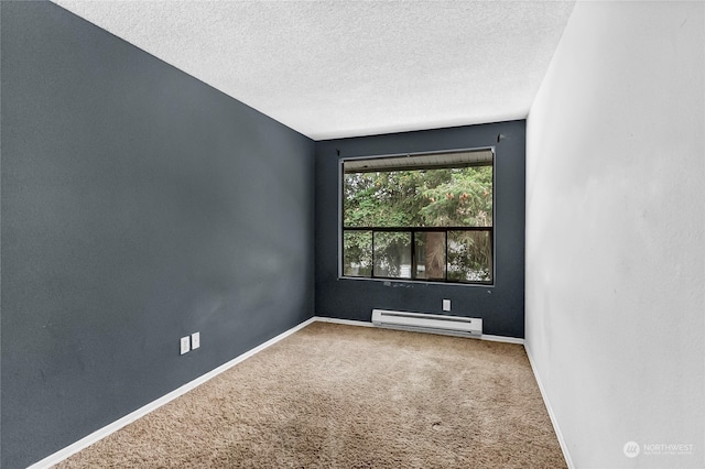 unfurnished room with baseboard heating, carpet, and a textured ceiling