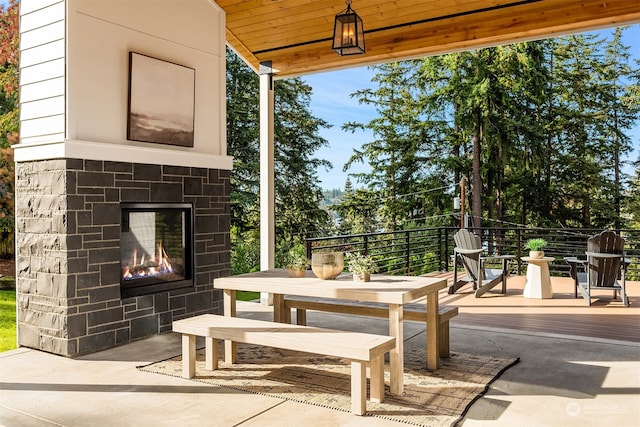 view of patio / terrace with an outdoor stone fireplace