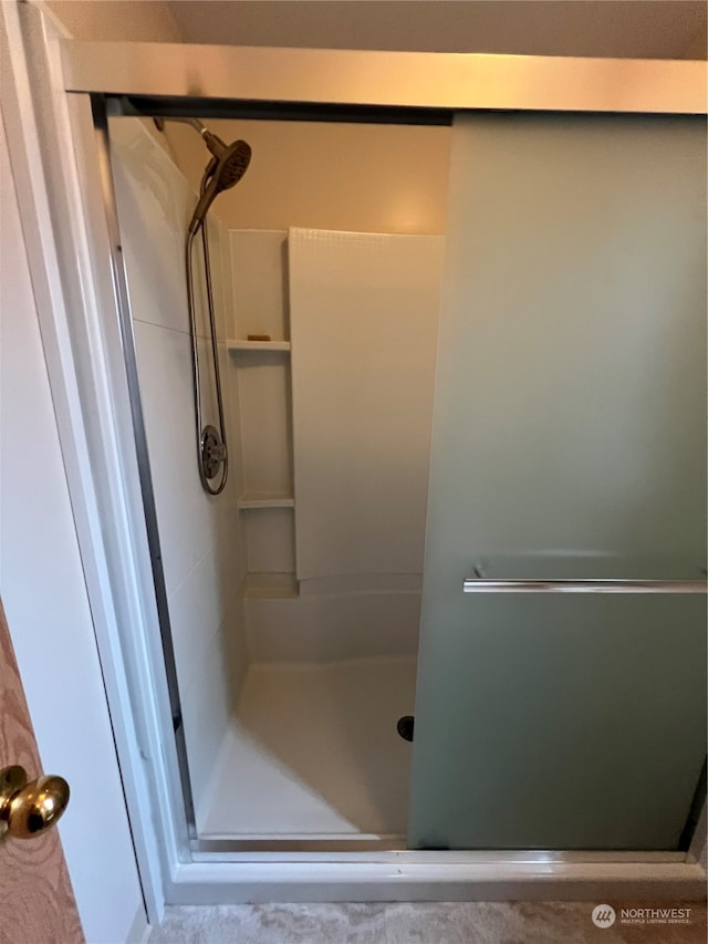 bathroom featuring walk in shower