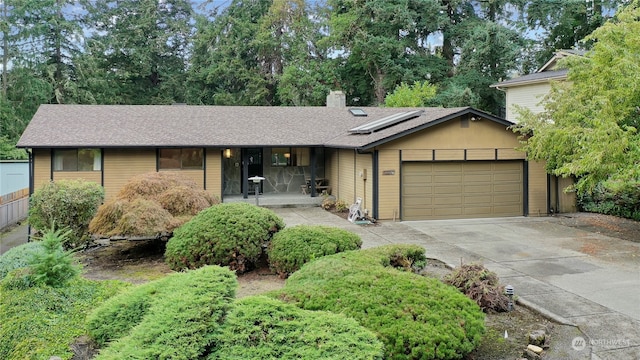 ranch-style house featuring a garage