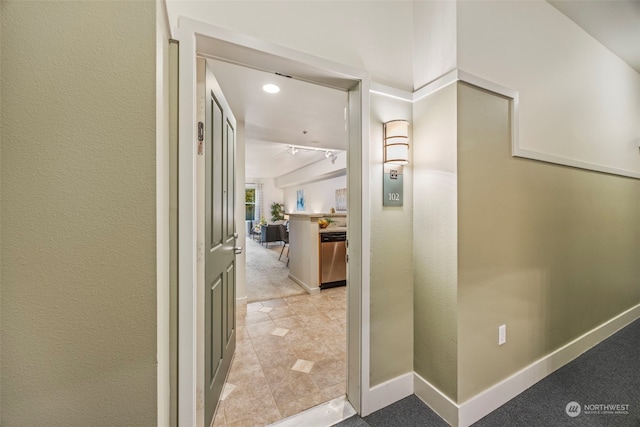 corridor with light tile patterned floors