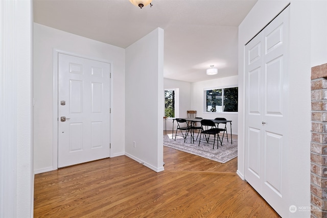 entryway with hardwood / wood-style flooring