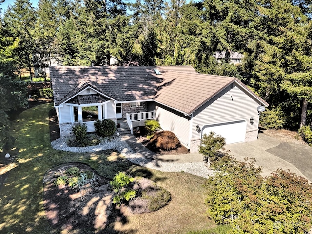 view of front of home featuring a front yard and a garage