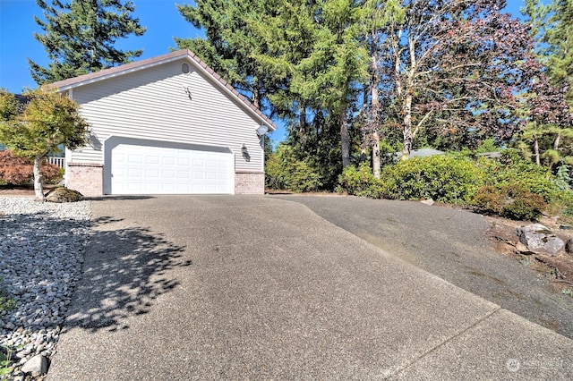 view of home's exterior with a garage