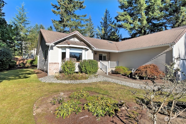 ranch-style home with a front lawn