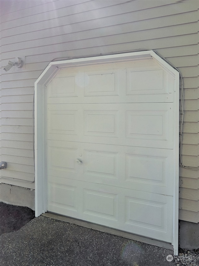 garage featuring wooden walls