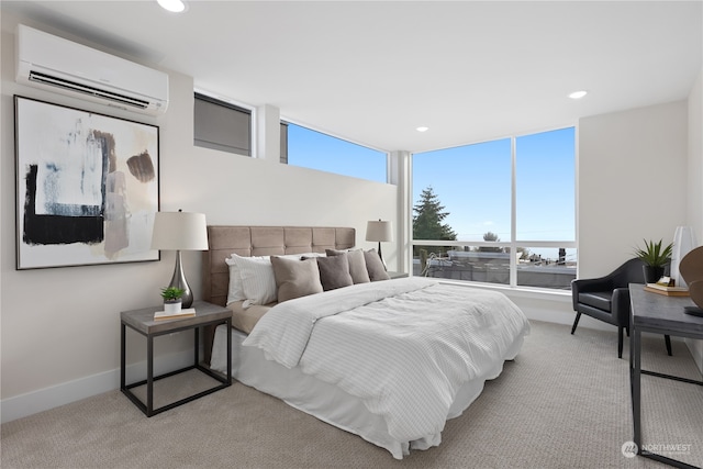 carpeted bedroom featuring a wall mounted AC