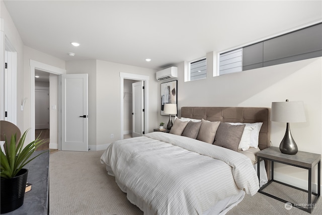 carpeted bedroom featuring an AC wall unit