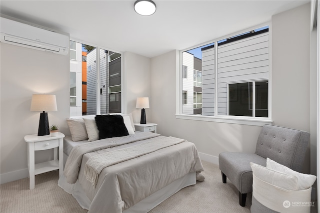 bedroom featuring light colored carpet and a wall mounted air conditioner