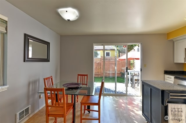 dining area featuring light wood-type flooring