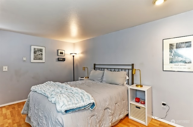 bedroom featuring wood-type flooring