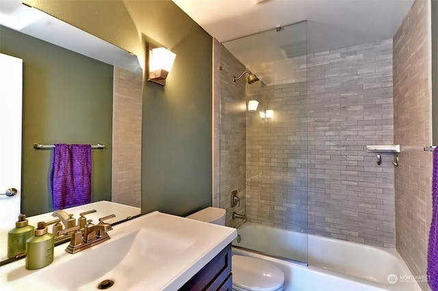 full bathroom featuring vanity, toilet, and enclosed tub / shower combo