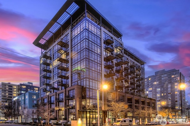 view of outdoor building at dusk