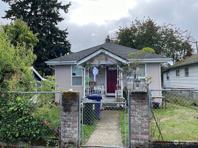 bungalow-style home featuring a front yard