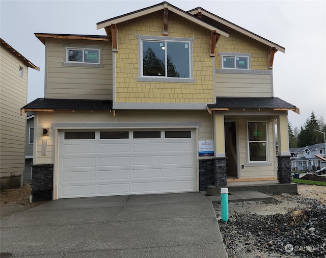 craftsman house with a garage