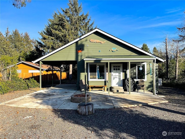 view of front of house with an outdoor fire pit