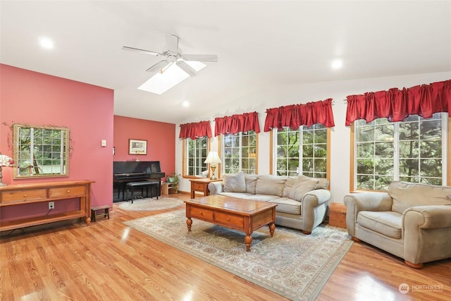 7220 Fair Oaks Loop SE, Olympia, WA 98513 - living area featuring a ceiling fan, vaulted ceiling, wood finished floors, a skylight, and recessed lighting