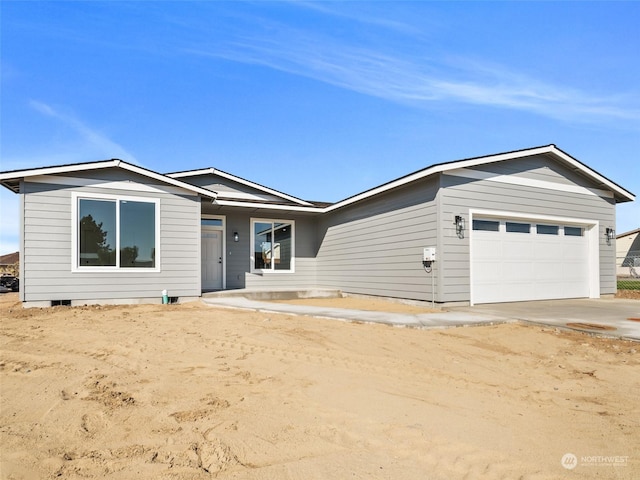 334 Spring Cir SW Unit 69, Mattawa, WA 99349 - ranch-style house with concrete driveway and an attached garage