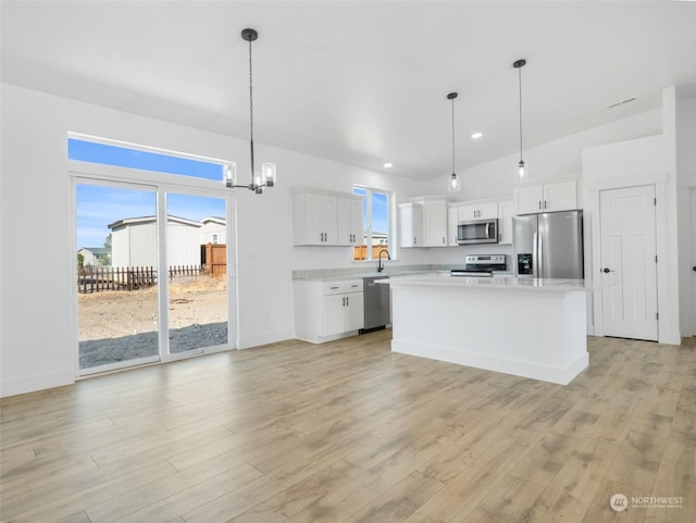 334 Spring Cir SW Unit 69, Mattawa, WA 99349 - kitchen featuring light wood finished floors, light countertops, appliances with stainless steel finishes, and white cabinets