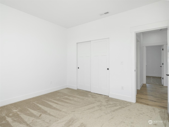334 Spring Cir SW Unit 69, Mattawa, WA 99349 - unfurnished bedroom featuring carpet, visible vents, baseboards, and a closet