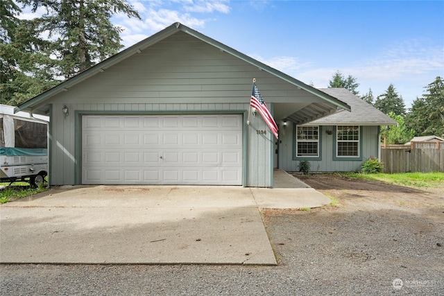 ranch-style home featuring a garage