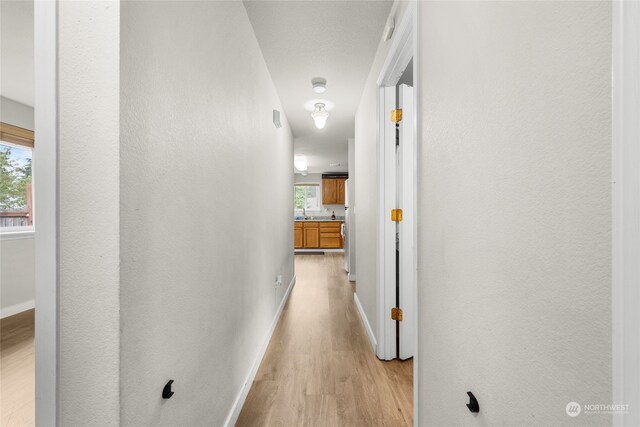 hallway featuring light wood-type flooring