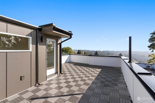 view of patio with a balcony