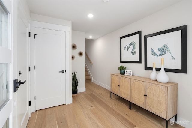 foyer entrance with hardwood / wood-style flooring