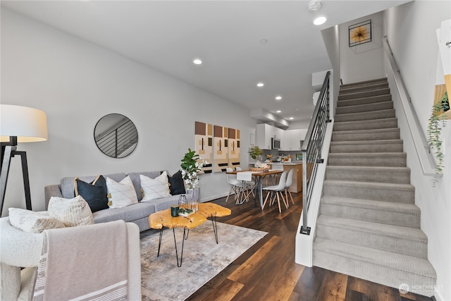 living room with dark hardwood / wood-style flooring