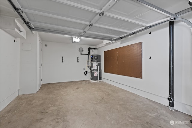 garage with strapped water heater and a garage door opener