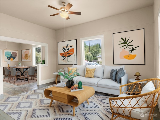 living room featuring hardwood / wood-style flooring and ceiling fan