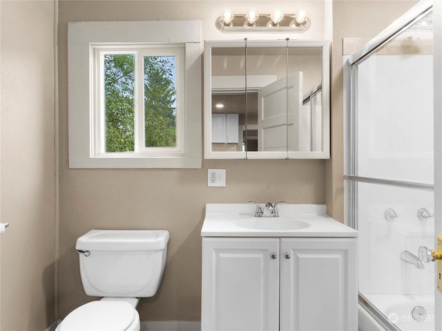 full bathroom with vanity, toilet, and enclosed tub / shower combo