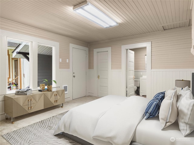 bedroom with light colored carpet, wood ceiling, connected bathroom, and wood walls