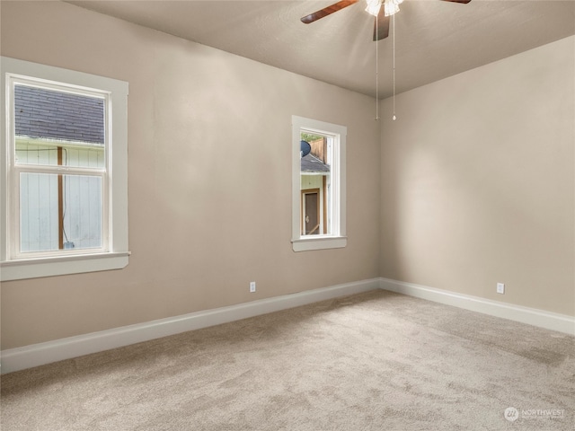 carpeted empty room with ceiling fan