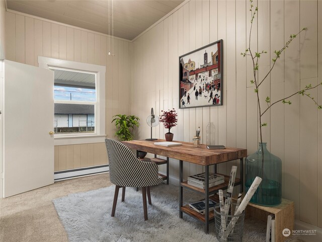 carpeted office with wood walls, ornamental molding, and baseboard heating