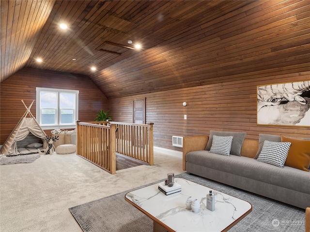 interior space with lofted ceiling, wood walls, and wood ceiling