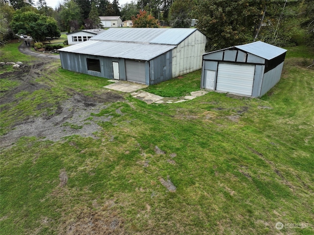 exterior space featuring a lawn and a garage