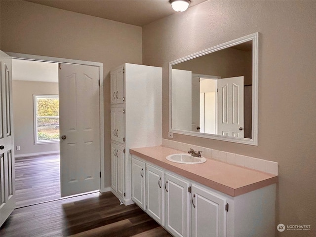 bathroom featuring wood-type flooring and vanity