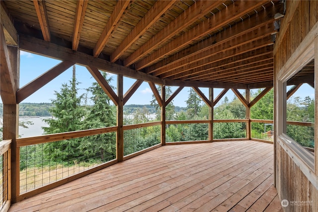 wooden terrace featuring a water view